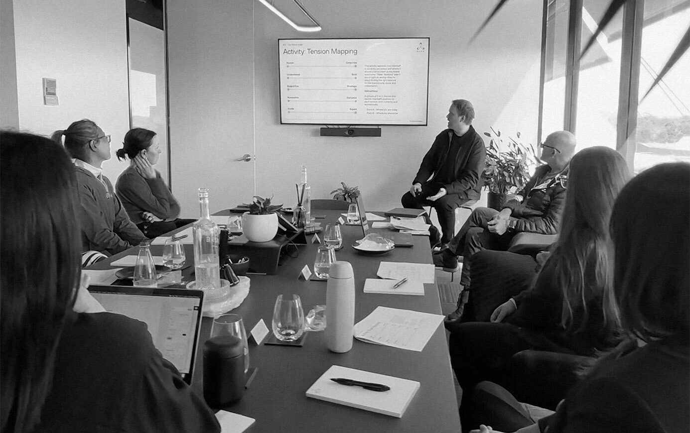 SLICK's creative team in a conference room with Interstaff, during a strategy workshop and meeting.