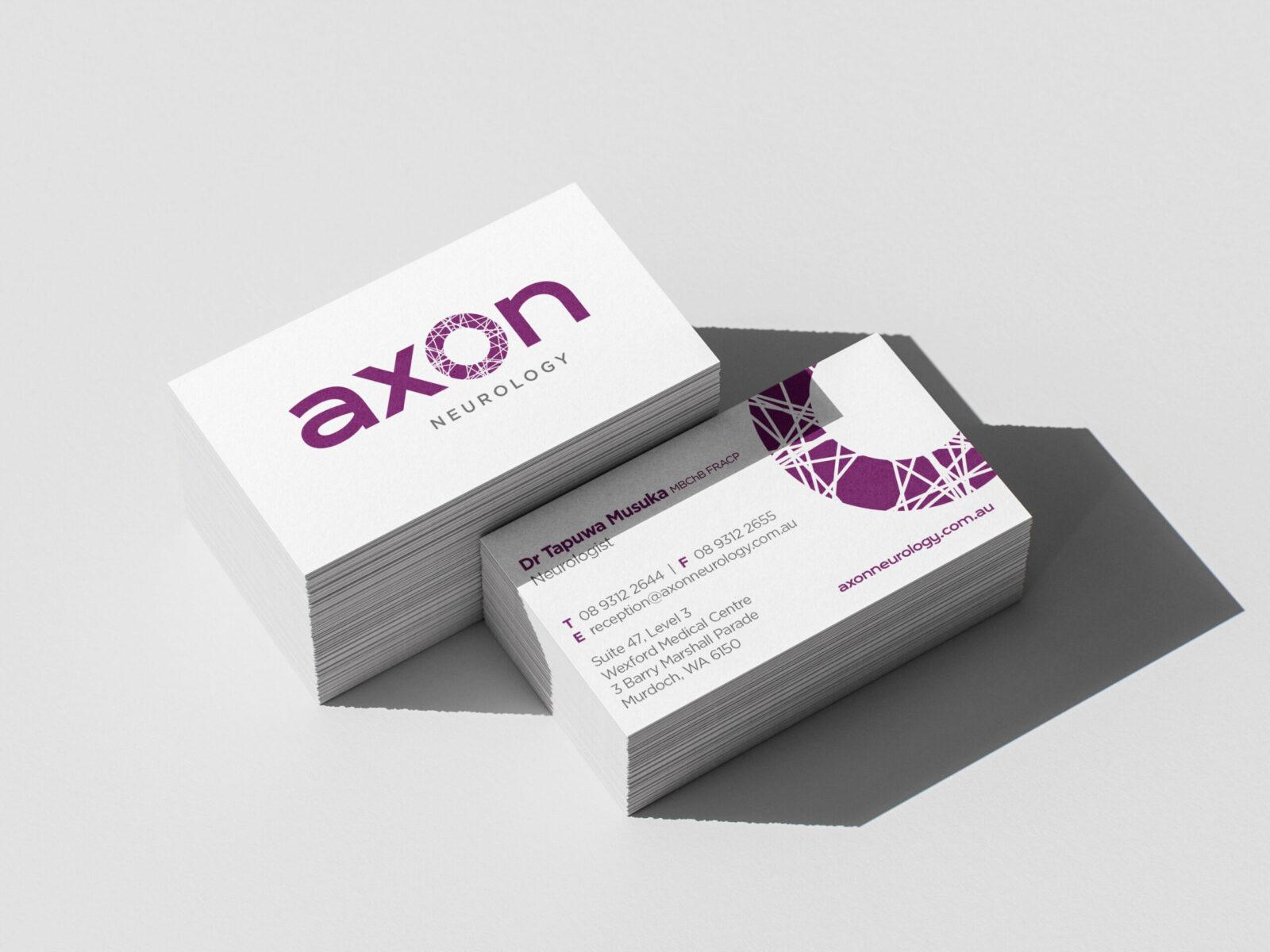 Two Axon Neurology business cards, showing the company logo and professional contact design.