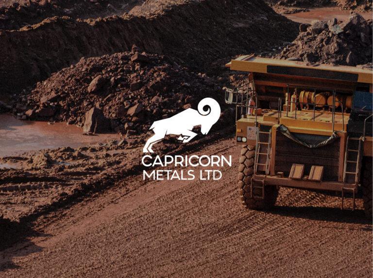 The Capricorn Metals Logo, displayed over an image of a mining quarry.