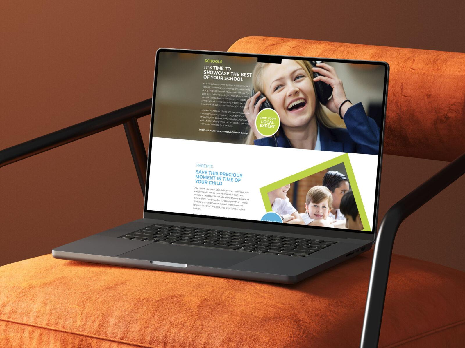 A laptop lies on a cushioned chair, showcasing the website design for MSP Photography.