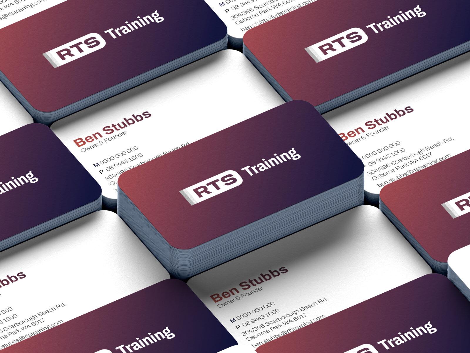 Stacks of business card examples for RTS Training.